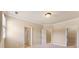 Bedroom featuring a light ceiling, plush carpet, and doorways to closet space at 3284 Kylee Dawn Cir, Lawrenceville, GA 30045