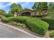 Stone entrance to Miramonte Ridge neighborhood with manicured hedges and flowerbeds at 3284 Kylee Dawn Cir, Lawrenceville, GA 30045