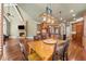 Open concept dining room with access to kitchen, fireplace, television, and access to the living room at 3284 Kylee Dawn Cir, Lawrenceville, GA 30045