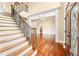Elegant entryway featuring hardwood floors, a staircase, and decorative trim at 3284 Kylee Dawn Cir, Lawrenceville, GA 30045