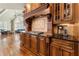 A great kitchen has custom wood cabinets, granite countertops, decorative tile backsplash, and gas range at 3284 Kylee Dawn Cir, Lawrenceville, GA 30045