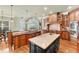 Gourmet kitchen with dual islands, custom cabinetry, granite counters, and modern stainless-steel appliances at 3284 Kylee Dawn Cir, Lawrenceville, GA 30045