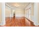 Bright living room featuring hardwood floors, white trim, shuttered windows and ample room for entertaining guests at 3284 Kylee Dawn Cir, Lawrenceville, GA 30045