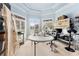 Bright office/studio featuring custom blue paint, large window, natural light, desk, and shelving at 3284 Kylee Dawn Cir, Lawrenceville, GA 30045