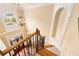 View of staircase and front door featuring hardwood steps and decorative trim at 3284 Kylee Dawn Cir, Lawrenceville, GA 30045