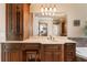 This custom vanity area features a make-up table, abundant storage and views to the shower and soaking tub at 3284 Kylee Dawn Cir, Lawrenceville, GA 30045
