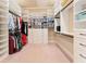 Spacious walk-in closet is complete with custom shelving, drawers, and ample storage space at 3284 Kylee Dawn Cir, Lawrenceville, GA 30045