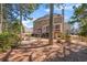 Exterior view of the house backyard featuring a patio, fire pit, and outdoor seating at 3640 Ridgeway Ter, Suwanee, GA 30024