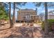 Large backyard featuring a patio with an outdoor seating area, fire pit and deck at 3640 Ridgeway Ter, Suwanee, GA 30024