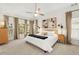 Spacious bedroom featuring a comfortable bed and windows with lots of natural light at 3640 Ridgeway Ter, Suwanee, GA 30024