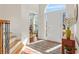Open foyer with a view of the front door, hardwood floors and beautiful trim work at 3640 Ridgeway Ter, Suwanee, GA 30024