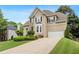 Well-maintained home boasting a stone facade, an attached two-car garage, and pristine landscaping at 3640 Ridgeway Ter, Suwanee, GA 30024