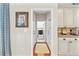 Hallway with laundry room featuring modern appliances and ample storage at 3640 Ridgeway Ter, Suwanee, GA 30024