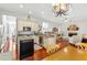 Spacious kitchen open to living area, stainless steel appliances, granite countertops at 3640 Ridgeway Ter, Suwanee, GA 30024