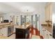 Open kitchen featuring granite countertops, stainless steel appliances, and a dining area at 3640 Ridgeway Ter, Suwanee, GA 30024