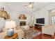 Inviting living room with stone fireplace, neutral palette, and wood floors at 3640 Ridgeway Ter, Suwanee, GA 30024