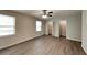 Spacious bedroom with new vinyl plank flooring and double door closet at 942 Ellison Ct, Austell, GA 30168