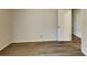 Spacious bedroom featuring wood floors and a conveniently located door at 942 Ellison Ct, Austell, GA 30168