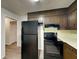 Kitchen with sleek black appliances at 942 Ellison Ct, Austell, GA 30168