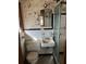 Bathroom with a vanity, toilet, and shower in disrepair, showing signs of wear and needing updates at 1581 Se Woodland Se Cir, Atlanta, GA 30316