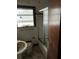 Bathroom with a window, toilet, and shower in disrepair, showing signs of wear and needing updates at 1581 Se Woodland Se Cir, Atlanta, GA 30316