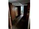 Hallway showing distressed wood paneling and deteriorated conditions throughout the space at 1581 Se Woodland Se Cir, Atlanta, GA 30316