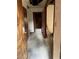 Hallway with multiple doorways, wood trim, and peeling paint in need of renovation at 1581 Se Woodland Se Cir, Atlanta, GA 30316