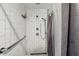 Bathroom features a modern tiled shower with updated fixtures and a handheld shower head at 215 Piedmont Ne Ave # 2103, Atlanta, GA 30308