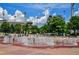 Centennial Olympic Park featuring a splash fountain, trees, and colorful international flags at 215 Piedmont Ne Ave # 2103, Atlanta, GA 30308