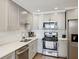 Bright kitchen features modern appliances, sleek countertops, and ample cabinet space at 215 Piedmont Ne Ave # 2103, Atlanta, GA 30308