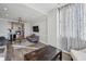 Open-concept living room and kitchen with stainless steel appliances, light gray cabinetry and hardwood flooring at 215 Piedmont Ne Ave # 2103, Atlanta, GA 30308