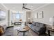 Bright living room featuring two sofas, a ceiling fan, crown molding and an attached sun room at 215 Piedmont Ne Ave # 2103, Atlanta, GA 30308