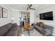 Comfortable living room with two sofas, hardwood flooring, a ceiling fan and a kitchen in the background at 215 Piedmont Ne Ave # 2103, Atlanta, GA 30308
