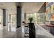 Well-lit lobby with floor-to-ceiling windows and an art display at 215 Piedmont Ne Ave # 2103, Atlanta, GA 30308