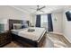 Inviting main bedroom with hardwood floors, neutral decor, a ceiling fan, and natural light at 215 Piedmont Ne Ave # 2103, Atlanta, GA 30308