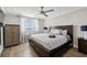 Spacious main bedroom with hardwood floors, a ceiling fan, ample storage and natural light at 215 Piedmont Ne Ave # 2103, Atlanta, GA 30308