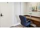 Home office space, equipped with desk, chair, and artwork at 215 Piedmont Ne Ave # 2103, Atlanta, GA 30308