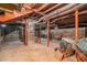 Unfinished basement with exposed pipes, block walls, and potential for customization and storage at 3074 Cascade Sw Rd, Atlanta, GA 30311