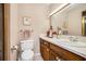 Bathroom featuring a vanity with a sink, light toned tiled walls and floors, and framed art at 3074 Cascade Sw Rd, Atlanta, GA 30311