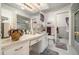 Neutral colored bathroom featuring a spacious countertop with sink and a fully tiled shower and floor at 3074 Cascade Sw Rd, Atlanta, GA 30311
