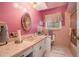 Quaint bathroom featuring a vintage vanity and sink, tiled walls and floors, and a shower with a glass door at 3074 Cascade Sw Rd, Atlanta, GA 30311