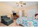 Bedroom with colorful bedding, carpet, and a desk at 3074 Cascade Sw Rd, Atlanta, GA 30311