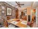 Dining area featuring a brick accent wall and access to the kitchen at 3074 Cascade Sw Rd, Atlanta, GA 30311