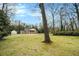 Front elevation of a grand brick home with a circular driveway and mature trees at 3074 Cascade Sw Rd, Atlanta, GA 30311
