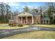 Elegant two-story brick home with a circular driveway and timeless architectural design at 3074 Cascade Sw Rd, Atlanta, GA 30311