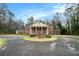 Stately brick home featuring a circular driveway and classic architectural details with large columns at 3074 Cascade Sw Rd, Atlanta, GA 30311