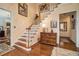 Grand foyer showcasing hardwood floors, staircase, and elegant decor at 3074 Cascade Sw Rd, Atlanta, GA 30311