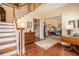 Grand foyer showcasing hardwood floors, elegant staircase, and a glimpse into the living spaces at 3074 Cascade Sw Rd, Atlanta, GA 30311
