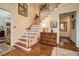 Inviting foyer with hardwood floors, staircase, and elegant decor at 3074 Cascade Sw Rd, Atlanta, GA 30311