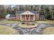 Elegant brick home with a circular driveway and meticulous landscaping for timeless appeal at 3074 Cascade Sw Rd, Atlanta, GA 30311